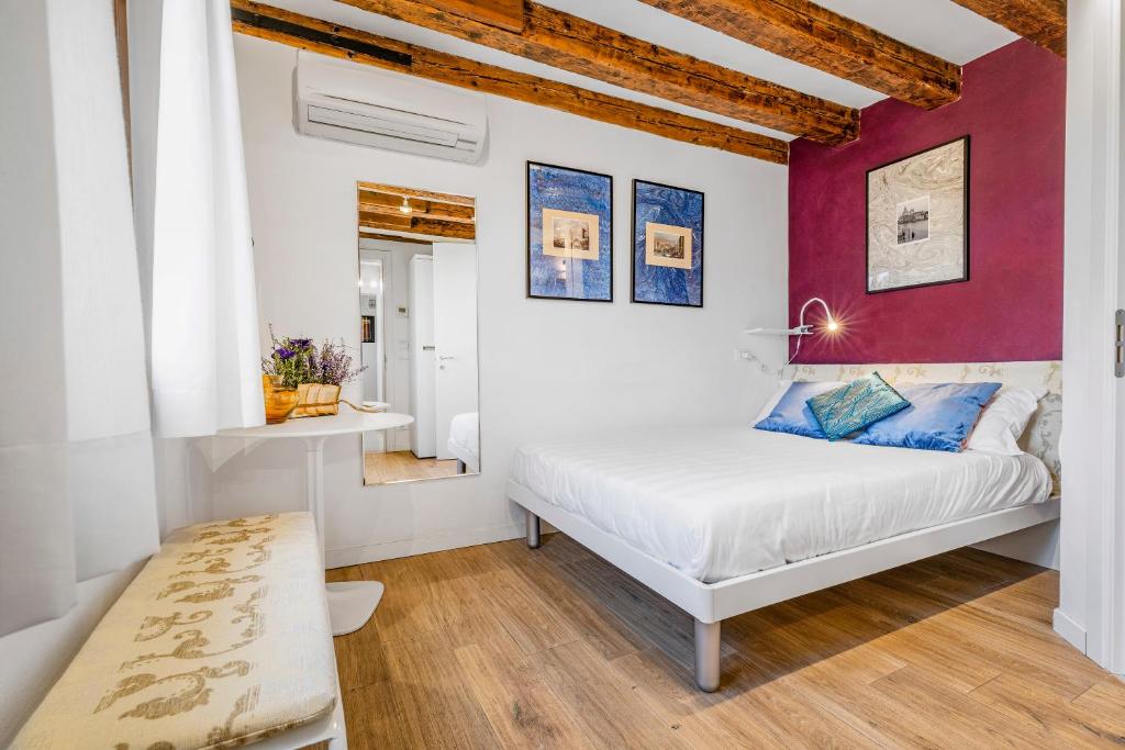 Posteľ alebo postele v izbe v ubytovaní Ca' dell'Arciere Apartments