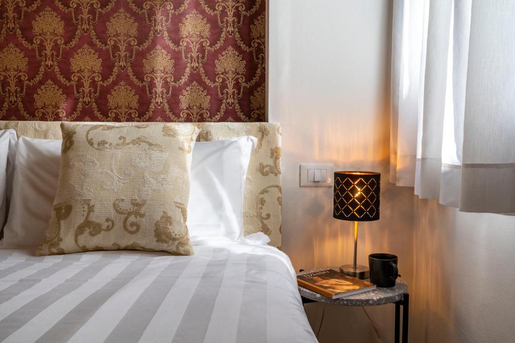 Posteľ alebo postele v izbe v ubytovaní Ca' dell'Arciere Apartments
