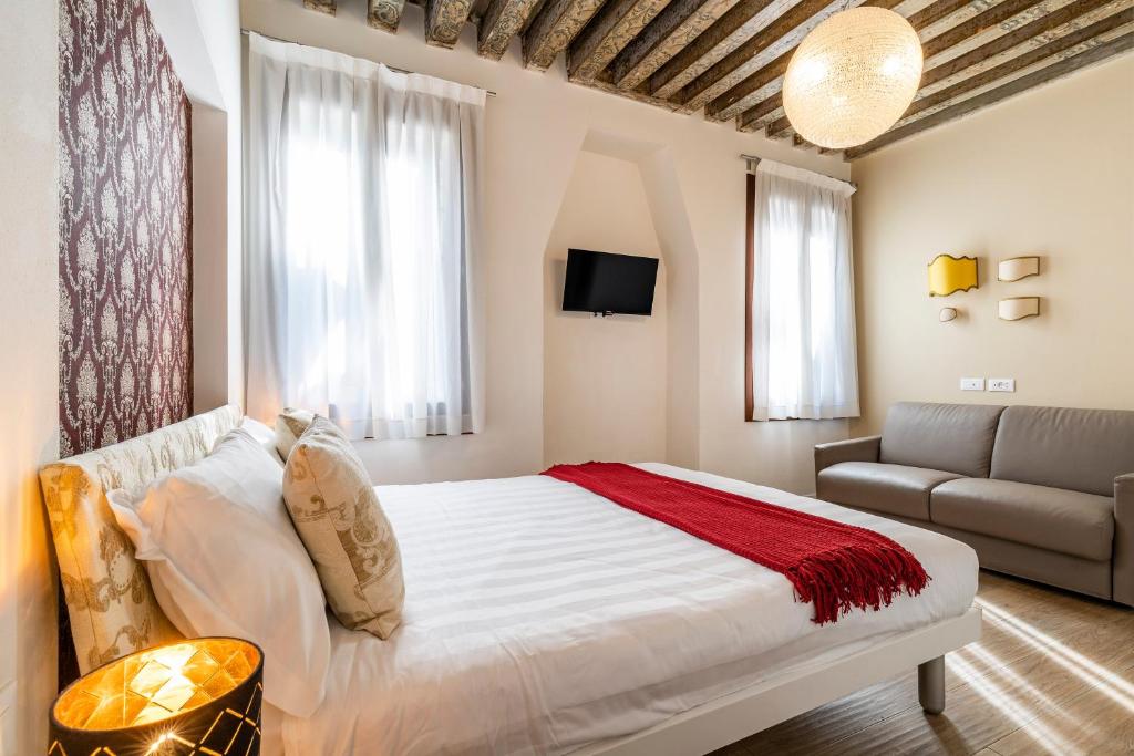 Posteľ alebo postele v izbe v ubytovaní Ca' dell'Arciere Apartments