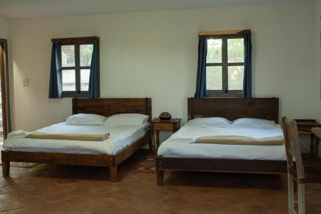 Llit o llits en una habitació de Posada San Lázaro