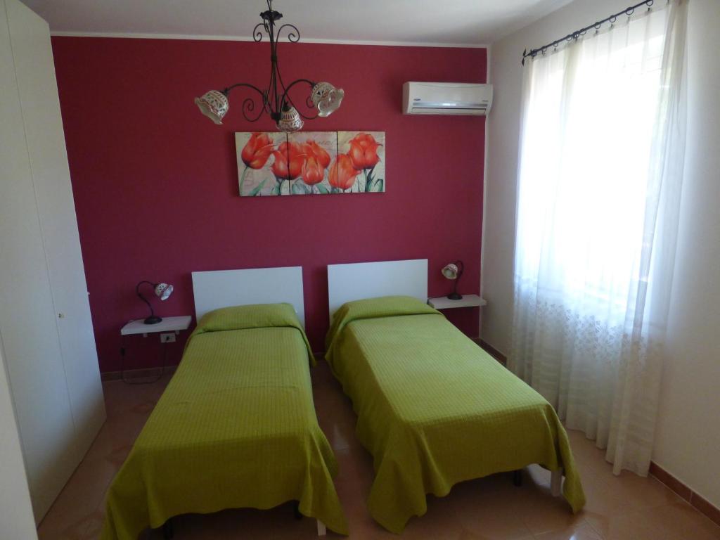 Łóżko lub łóżka w pokoju w obiekcie Villa Maria
