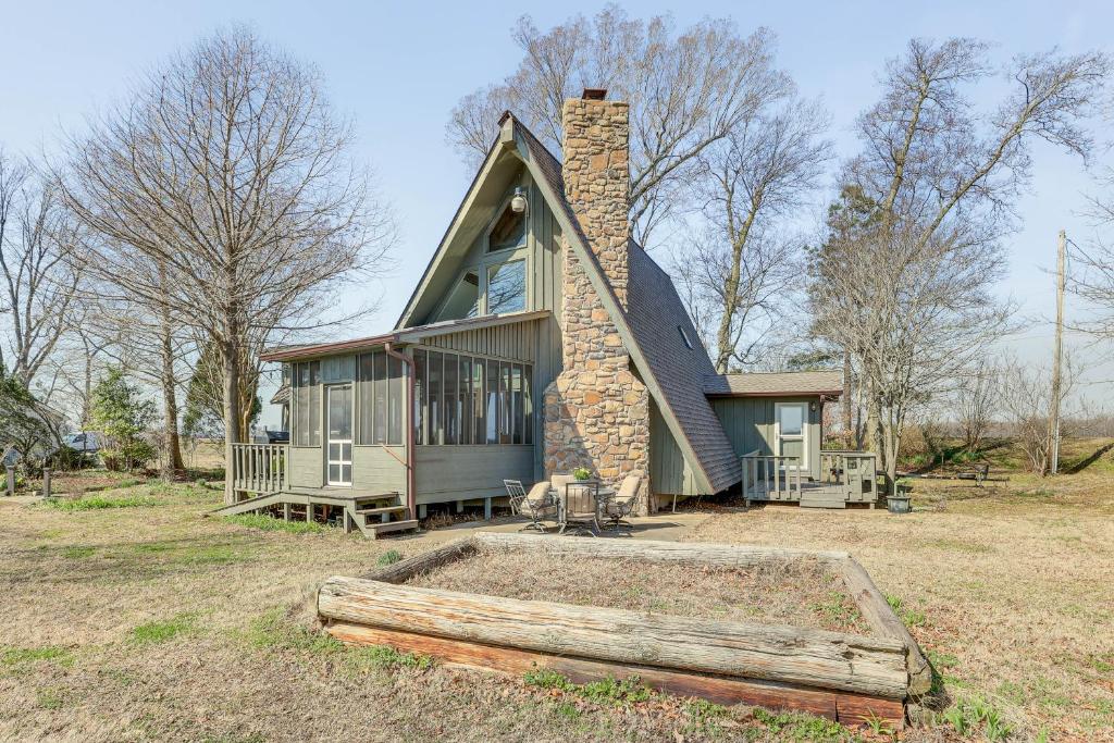 a small house with a chimney on top of it at Boat Dock on Reelfoot Lake Tiptonville Retreat in Tiptonville