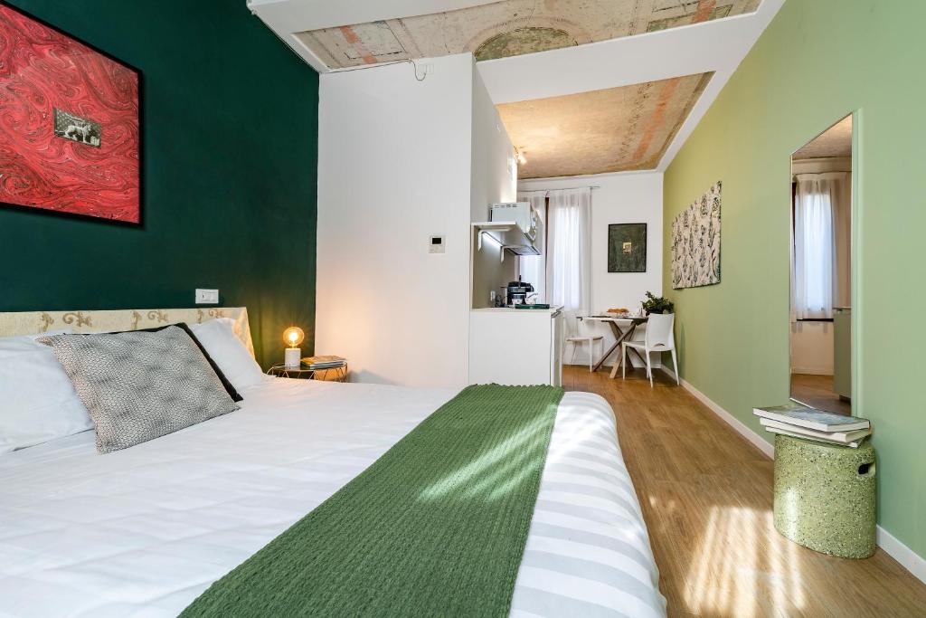 Posteľ alebo postele v izbe v ubytovaní Ca' dell'Arciere Apartments