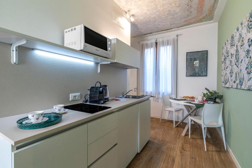 Kuchyňa alebo kuchynka v ubytovaní Ca' dell'Arciere Apartments
