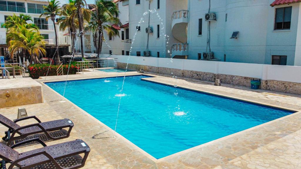 Bazén v ubytování Hotel Caribe Coveñas nebo v jeho okolí