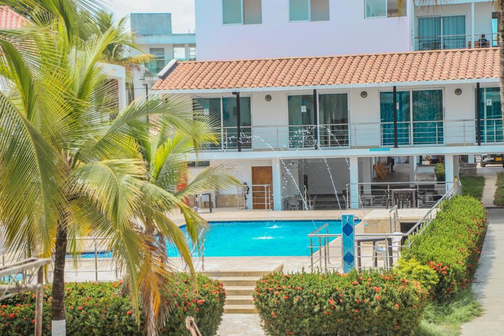 Bazén v ubytování Hotel Caribe Coveñas nebo v jeho okolí