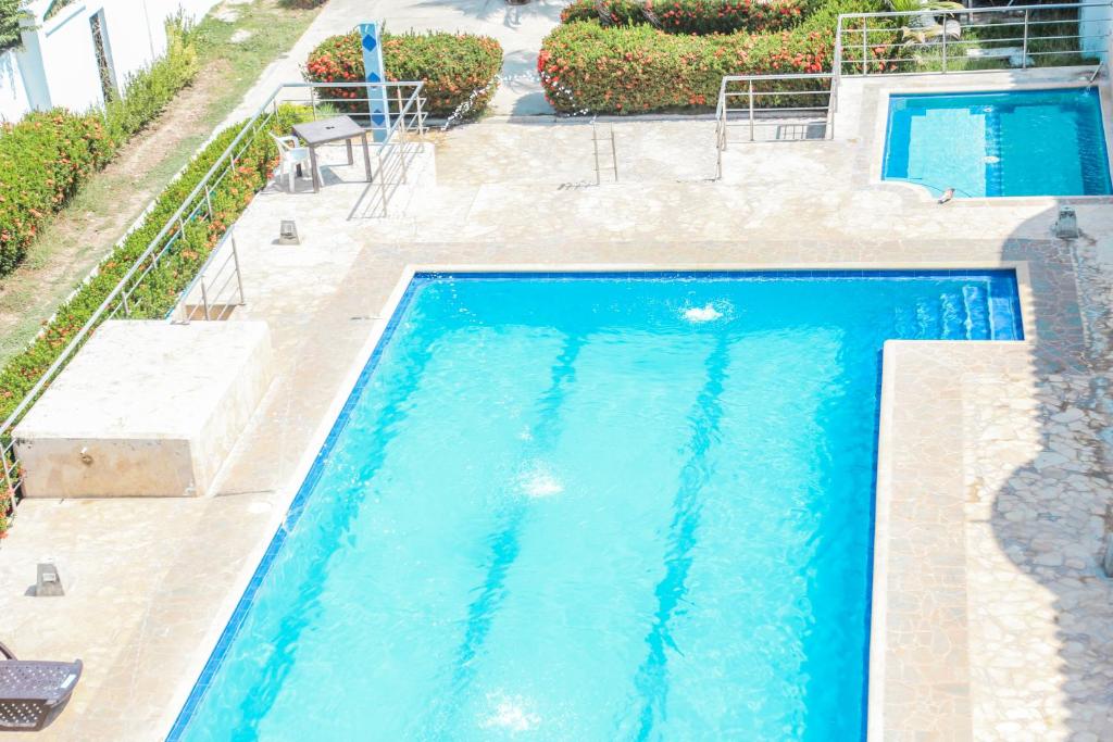 Bazén v ubytování Hotel Caribe Coveñas nebo v jeho okolí