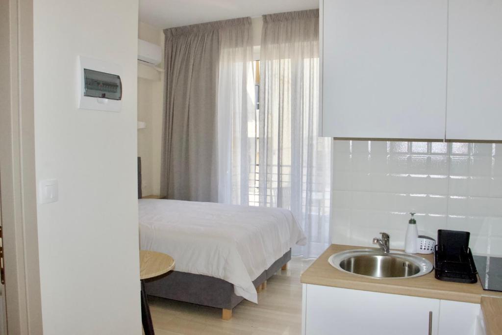 Postel nebo postele na pokoji v ubytování Piraeus Relax