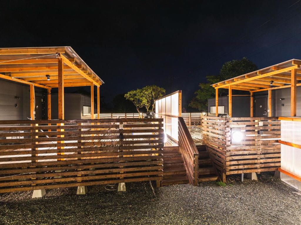 a couple of wooden buildings with a night background at Ashigarashimogun - Glamping - Vacation STAY 64129v in Sengokuhara