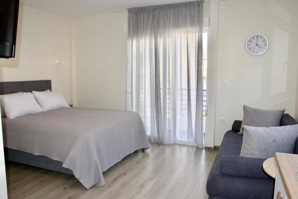 Postel nebo postele na pokoji v ubytování Piraeus Relax