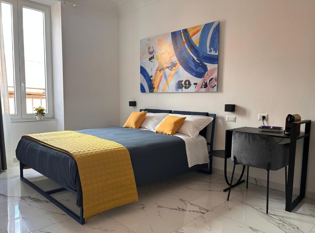 Postel nebo postele na pokoji v ubytování Napoli Oltre Rooms
