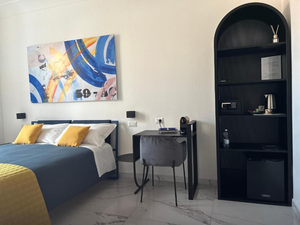 Postel nebo postele na pokoji v ubytování Napoli Oltre Rooms