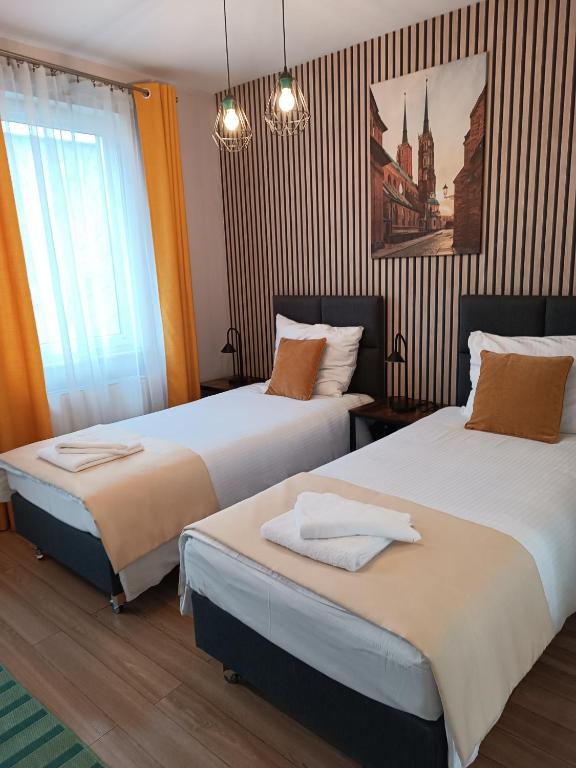 Posteľ alebo postele v izbe v ubytovaní Sleep In Apartament Centrum