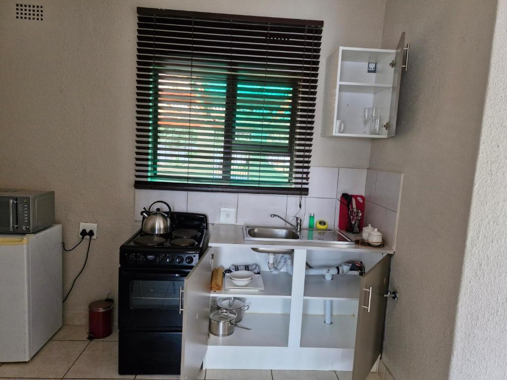 Kuchyň nebo kuchyňský kout v ubytování Botle Hive