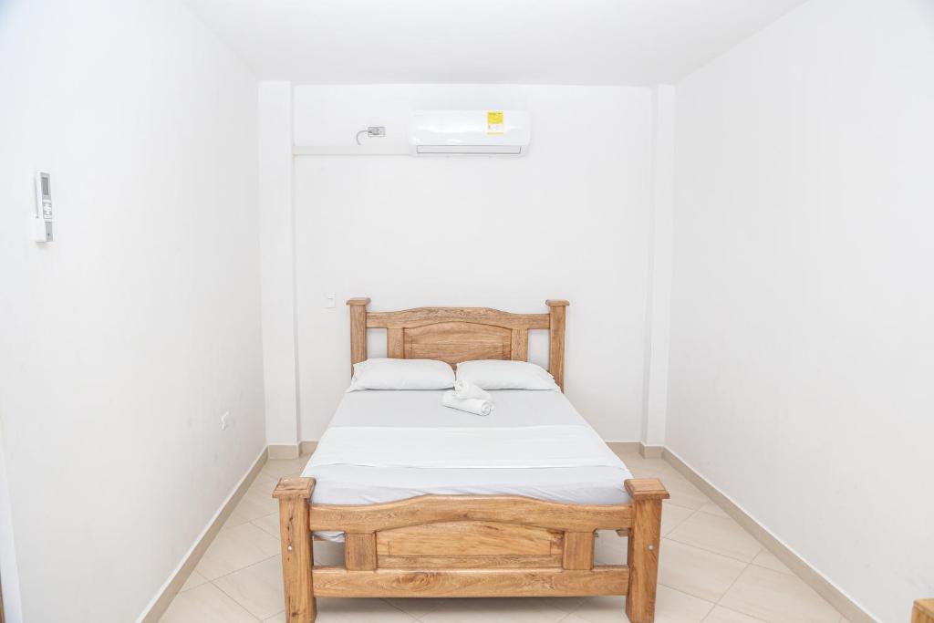 Postel nebo postele na pokoji v ubytování Hotel Caribe Coveñas