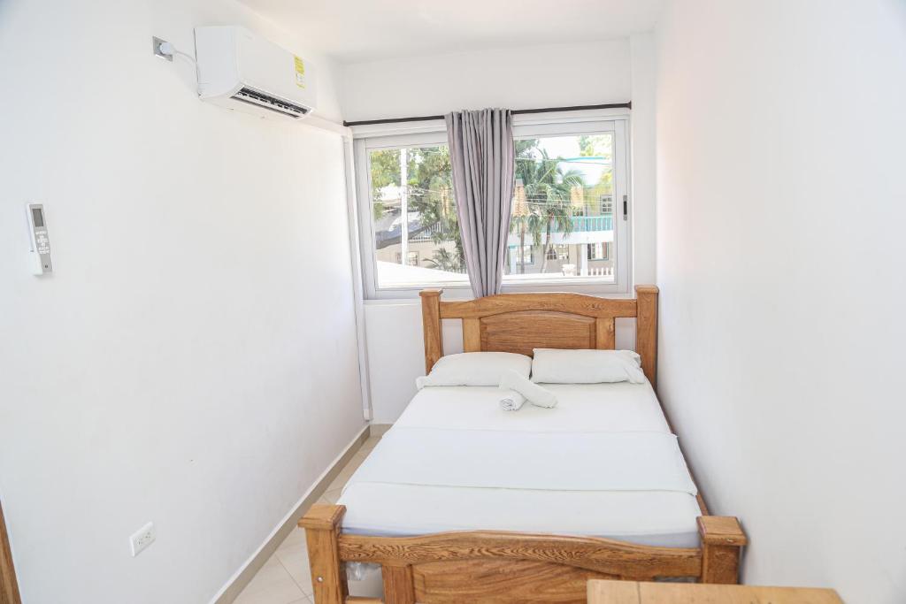 Tempat tidur dalam kamar di Hotel Caribe Coveñas