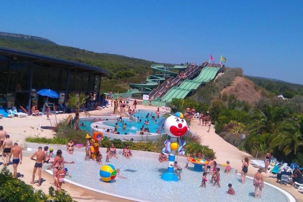 a group of people in a pool at a water park at Logement T2 au coeur du village in Gruissan