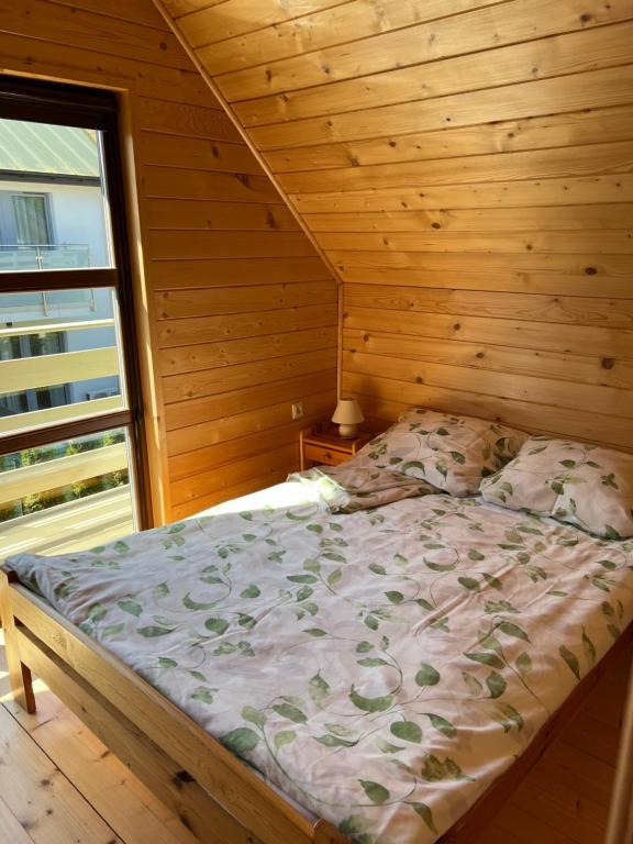 Postel nebo postele na pokoji v ubytování Domki letniskowe Gala