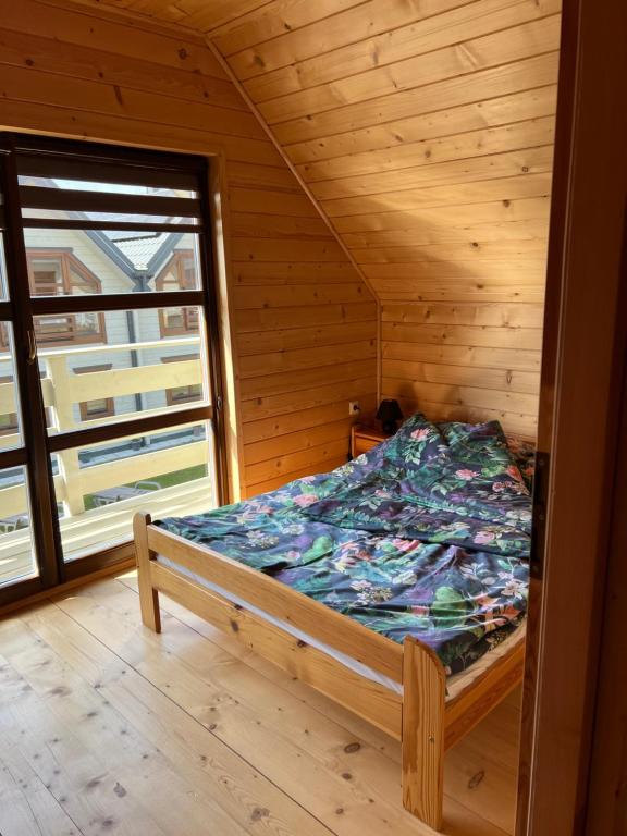 Postel nebo postele na pokoji v ubytování Domki letniskowe Gala