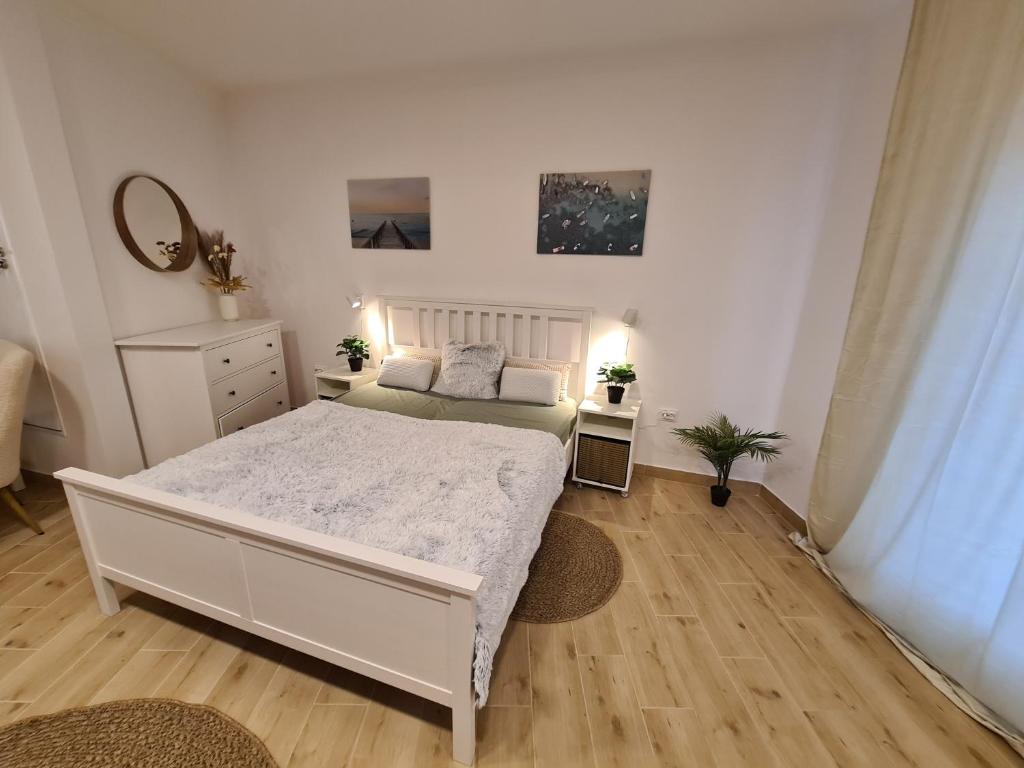 Posteľ alebo postele v izbe v ubytovaní Kedves Apartman