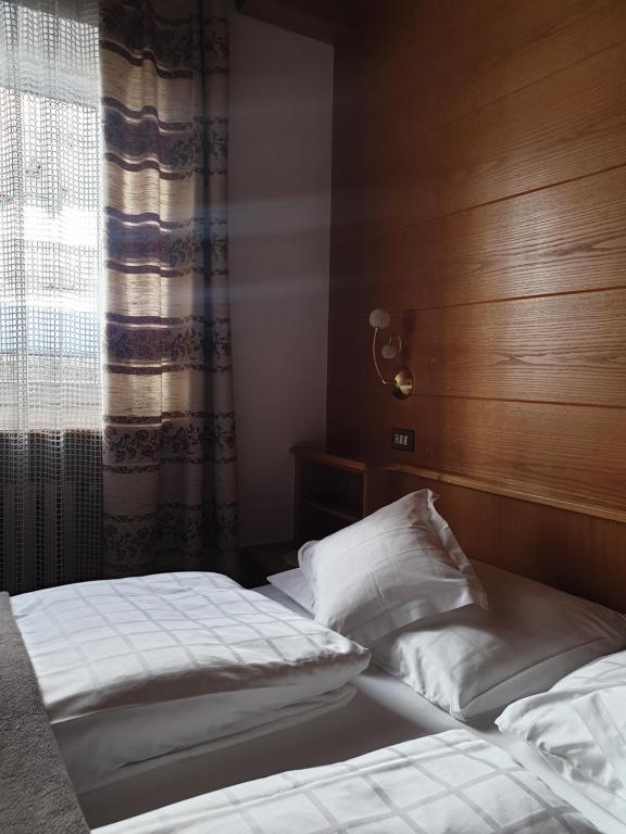 Postel nebo postele na pokoji v ubytování Garni Le Chalet