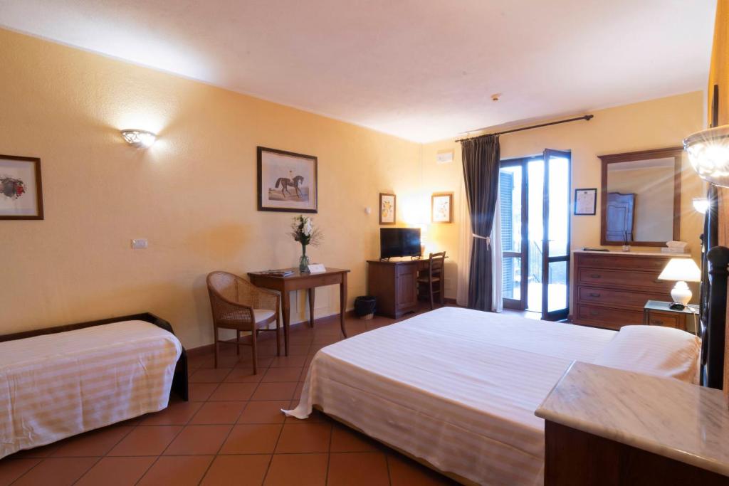Postel nebo postele na pokoji v ubytování Antico Casale Di Scansano Resort