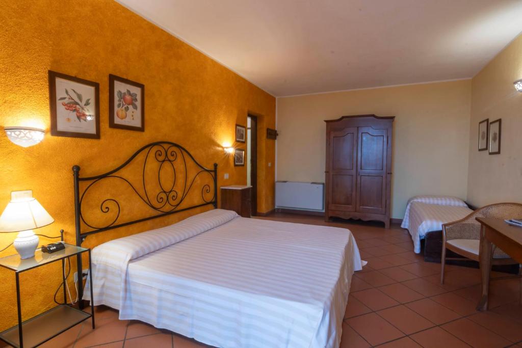 Postel nebo postele na pokoji v ubytování Antico Casale Di Scansano Resort