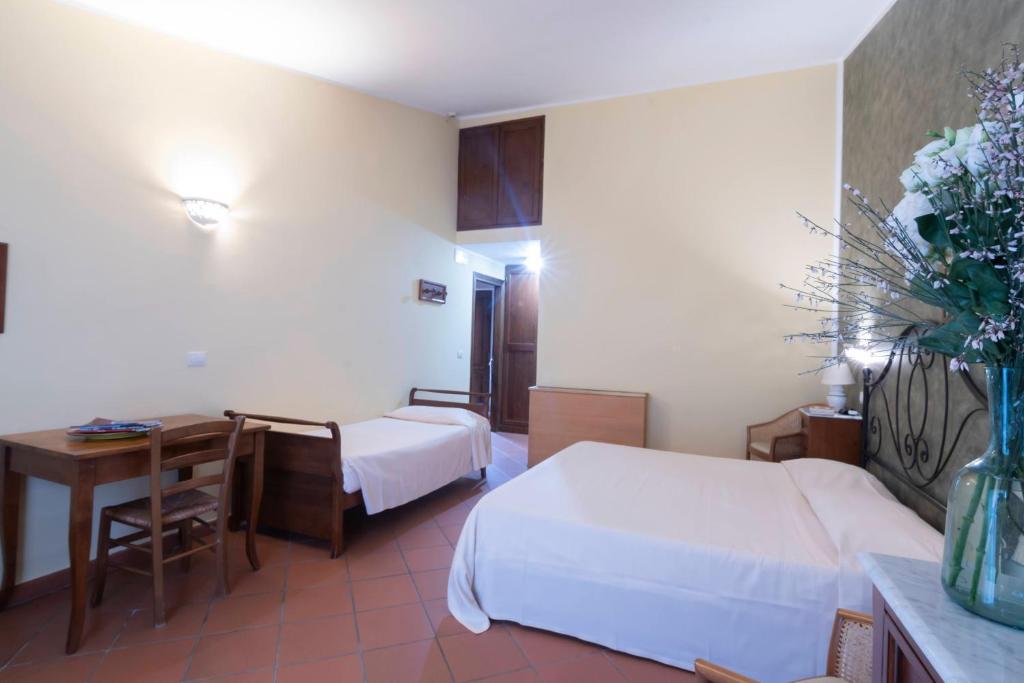 Postel nebo postele na pokoji v ubytování Antico Casale Di Scansano Resort