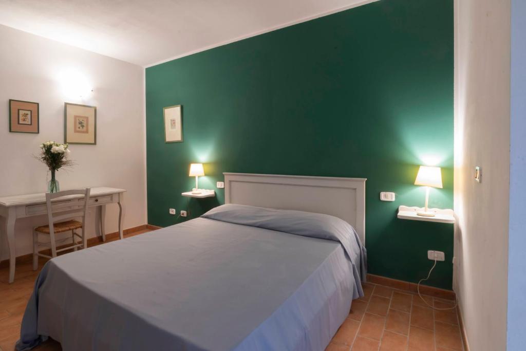 Postel nebo postele na pokoji v ubytování Antico Casale Di Scansano Resort