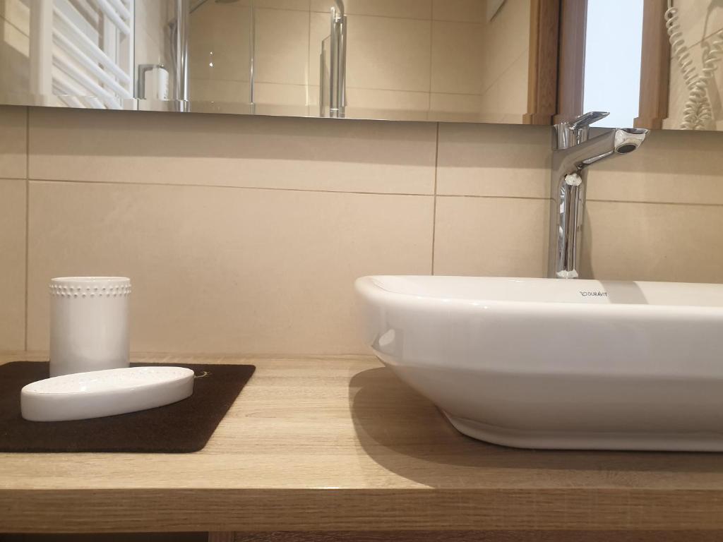 Koupelna v ubytování Garni Le Chalet