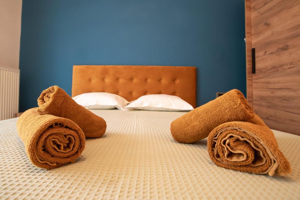 Postel nebo postele na pokoji v ubytování ELEGANCE SUITES