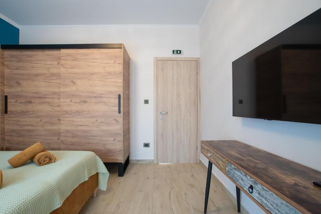 Postel nebo postele na pokoji v ubytování ELEGANCE SUITES
