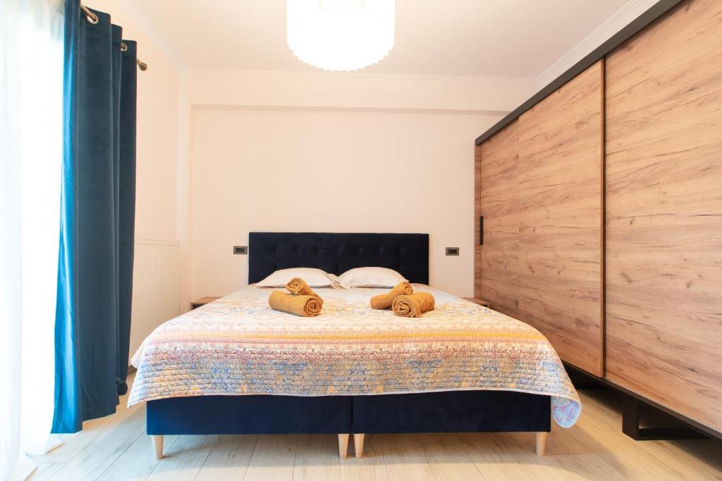 Postel nebo postele na pokoji v ubytování ELEGANCE SUITES