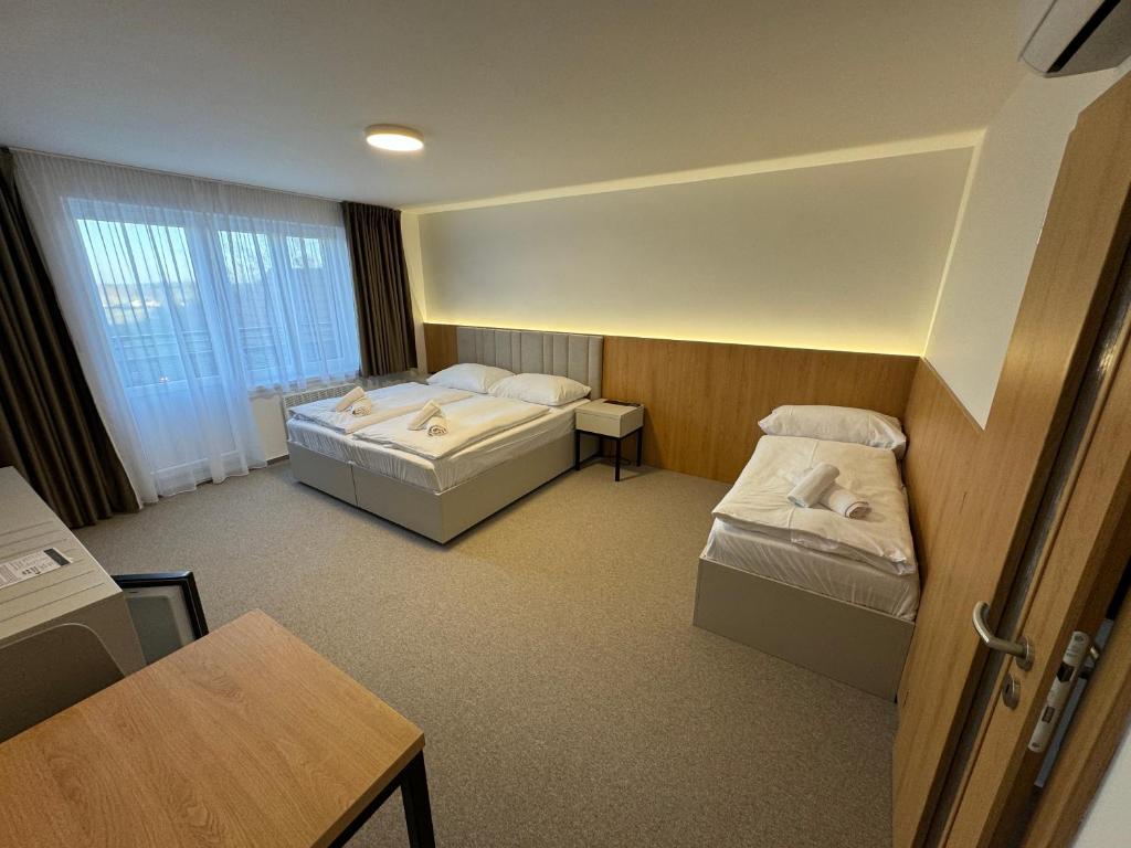 Postel nebo postele na pokoji v ubytování Comfort Pálava, Penzion Klentnice - Mikulov - Pálava