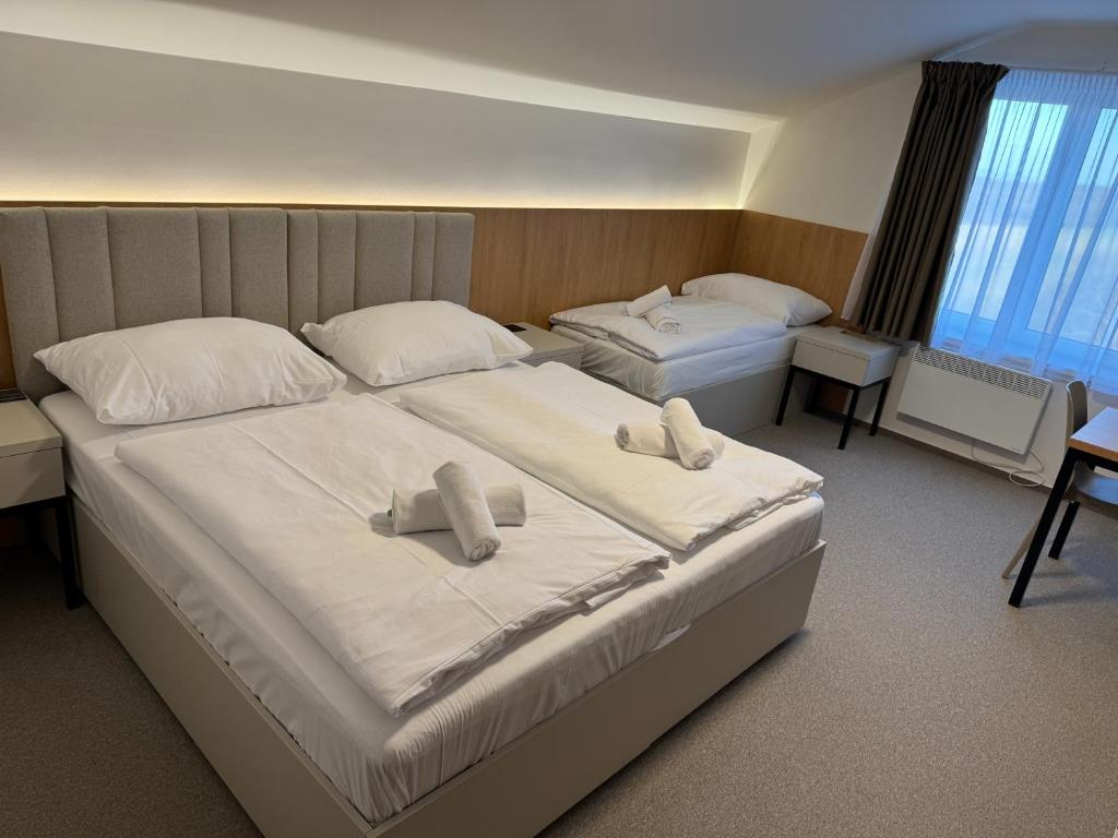 Postel nebo postele na pokoji v ubytování Comfort Pálava, Penzion Klentnice - Mikulov - Pálava