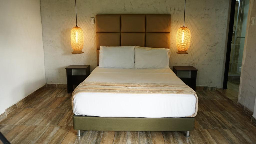 Postel nebo postele na pokoji v ubytování Dreams Hotel y Restaurante