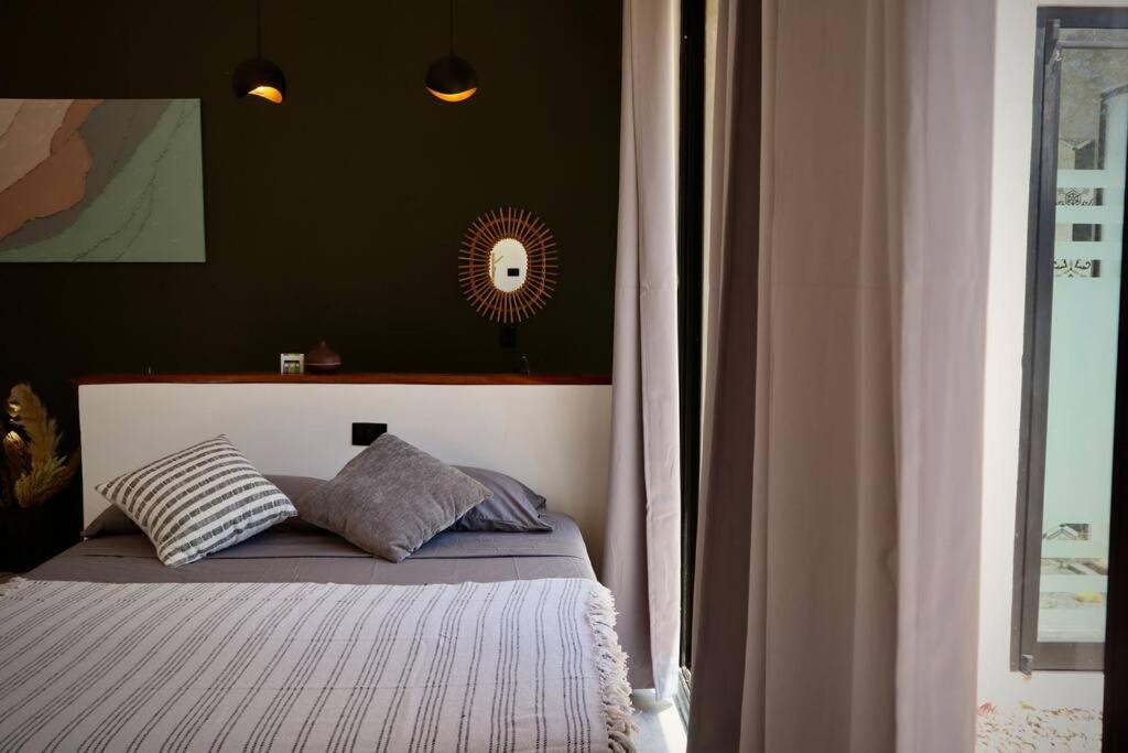 Postel nebo postele na pokoji v ubytování Highlight Studio Apartment in Playa Negra