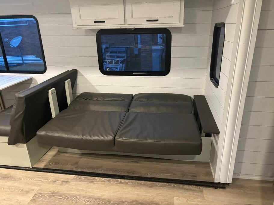 a couch in the back of an rv at Feel the Vibe in Pensacola