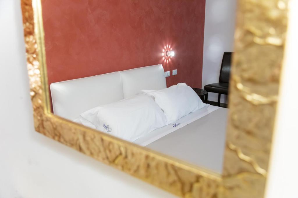 Postel nebo postele na pokoji v ubytování Le Sirene B&B