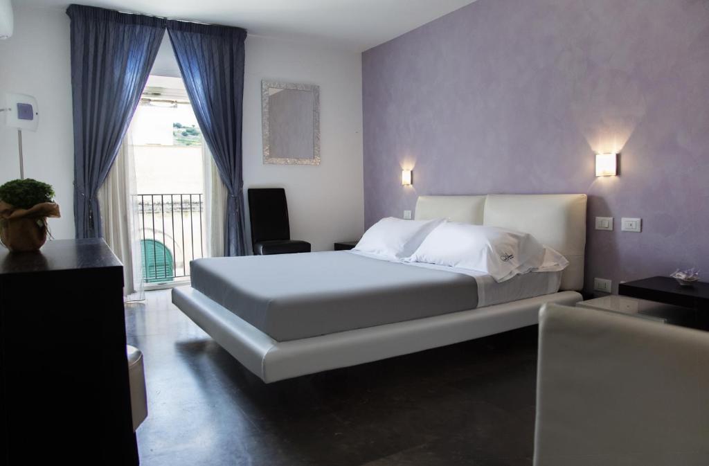 Postel nebo postele na pokoji v ubytování Le Sirene B&B
