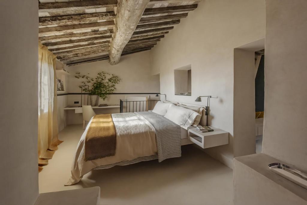 Postel nebo postele na pokoji v ubytování Monteverdi Tuscany