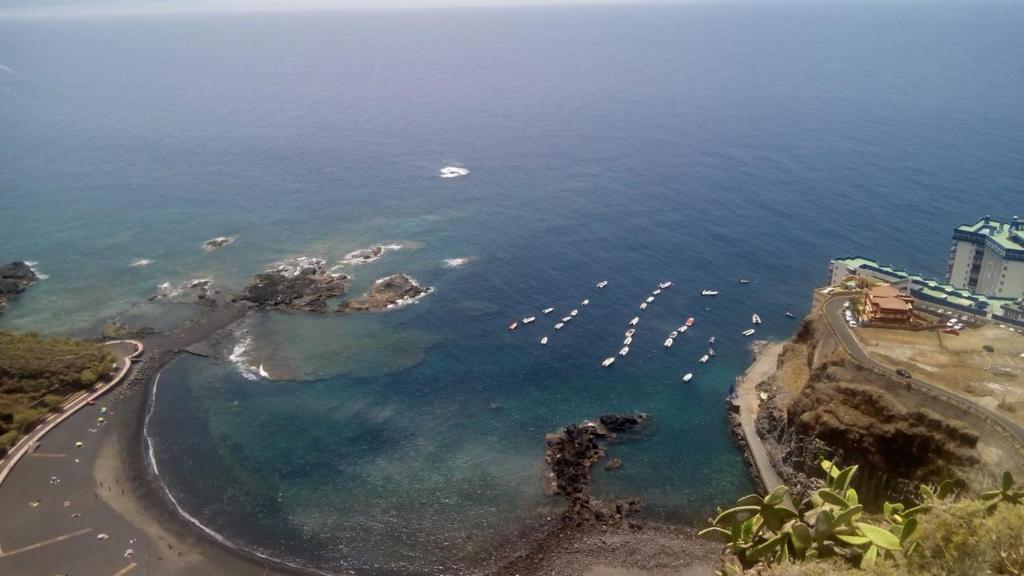 an aerial view of a beach with boats in the water at MasRelaxTenerife in La Laguna