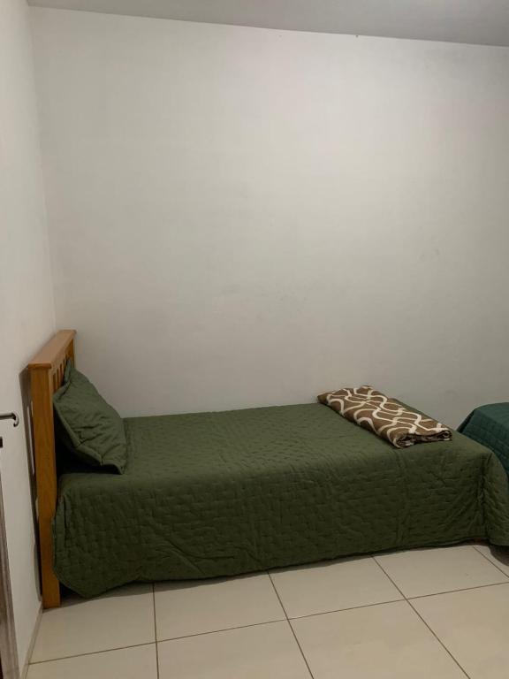 Voodi või voodid majutusasutuse Ninho das Harpias toas