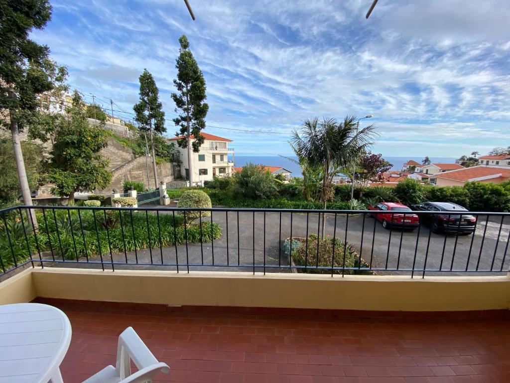 a balcony with a view of a parking lot at Inmaculado Apartment in Funchal