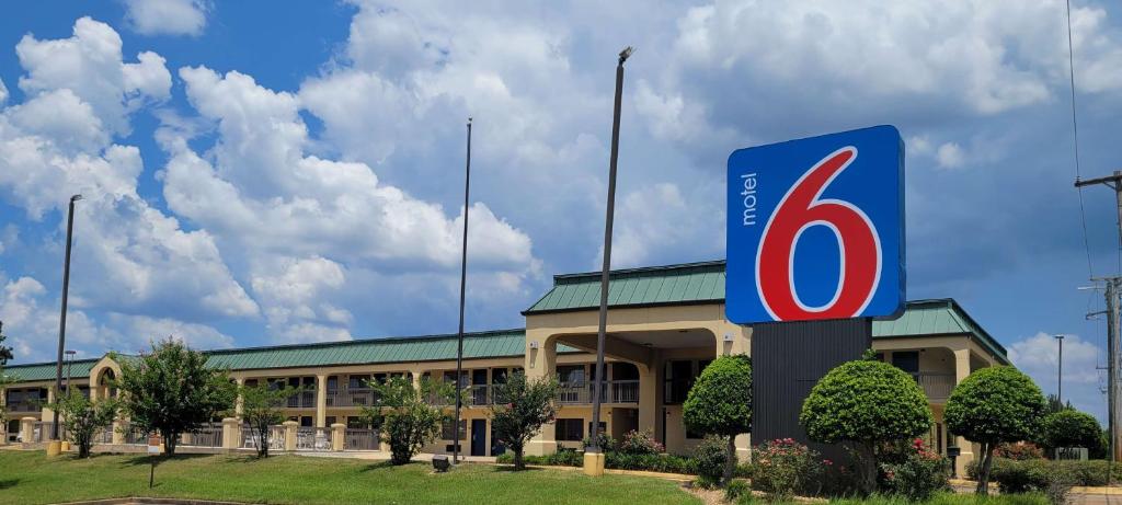 a building with a number six sign in front of it at Motel 6 Jackson MS Southwest in Jackson