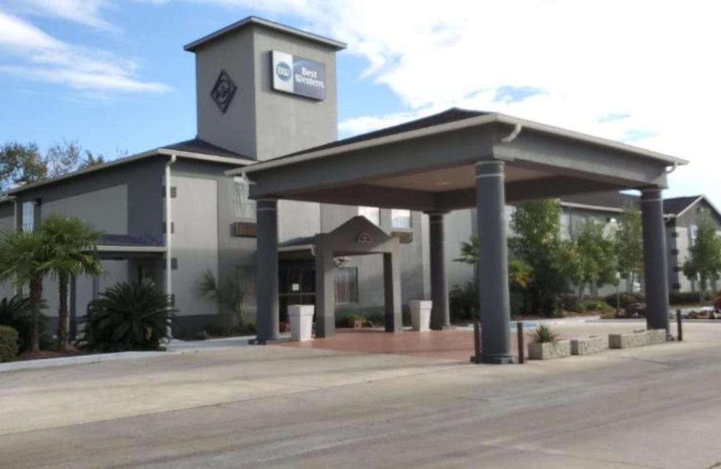 a gas station in front of a building at Best Western Zachary Inn in Zachary