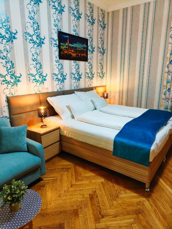 Posteľ alebo postele v izbe v ubytovaní King Apartment