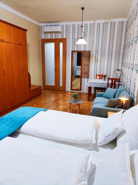 Posteľ alebo postele v izbe v ubytovaní King Apartment