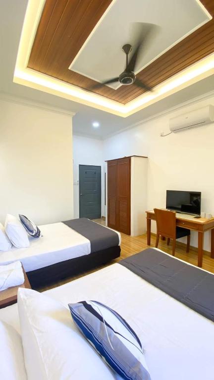 Postel nebo postele na pokoji v ubytování Eleven25 Roomstay