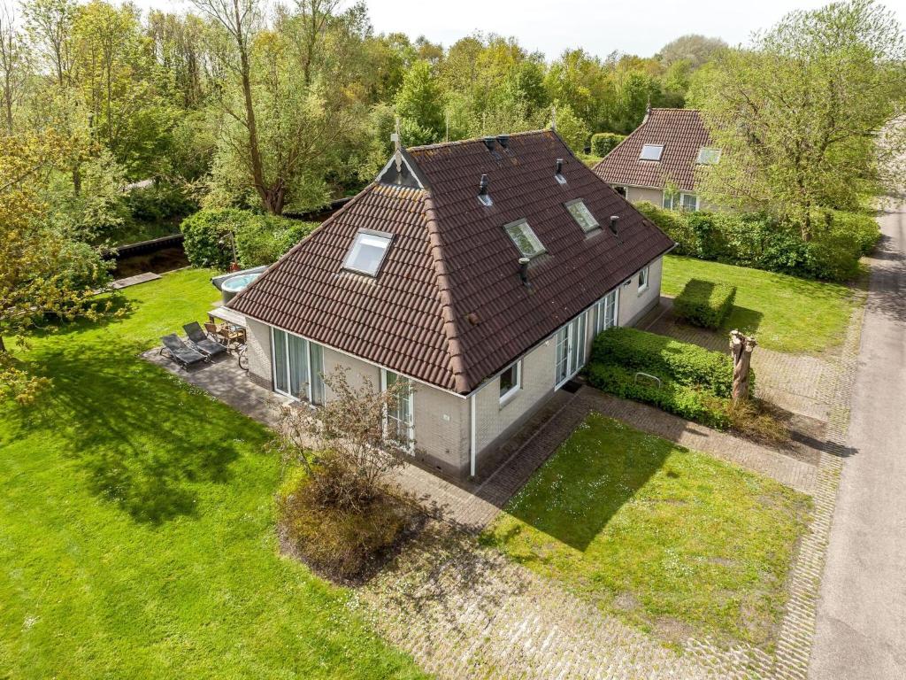 an overhead view of a house with a roof at Family-Friendly Nature Stay in Earnewâld